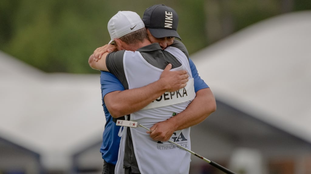 Brooks Koepka hugs his Irish caddie as he celebrates winning the PGA Championship. Photograph: Hilary Swift/The New York Times