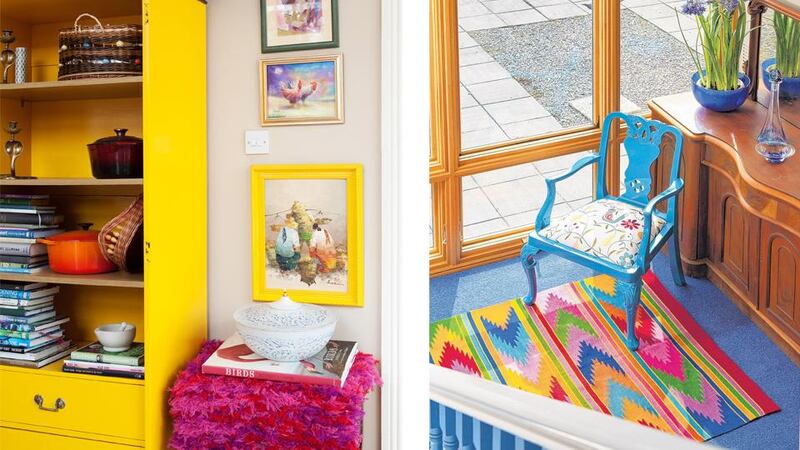 Left: A gentleman’s wardrobe has been stripped of its doors and painted canary yellow to make a cool kitchen dresser. The stool is covered by a throw bought at the Meitheal Weavery in Dunlavin.Right: The half-landing is covered in an eye-popping cornflower blue Curragh carpet, zig-zag rug and rehabbed chair. Photographs: Paul Sherwood