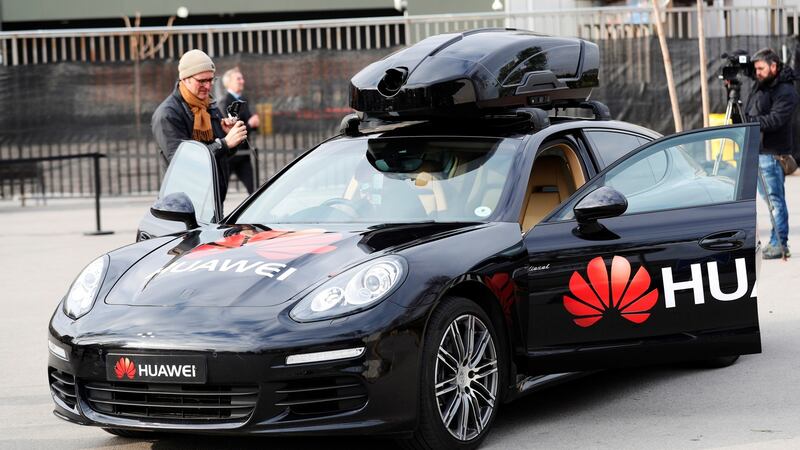 A view of a driverless Porsche car controled by Huawai’s Mate 10 Pro handset that transforms a regular car into a self-driving vehicle during the presentation of Huawai’s Mate 10 Pro technology at the MWC