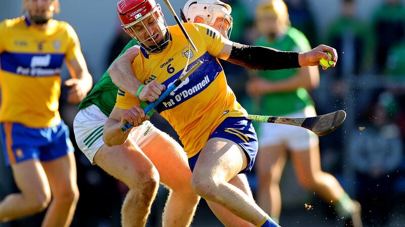 Clare’s John Conlon's hurl is broken as he is tackled by Limerick's Cian Lynch during the the drawn league clash at Cusack Park, Ennis.  Photograph: James Crombie/Inpho