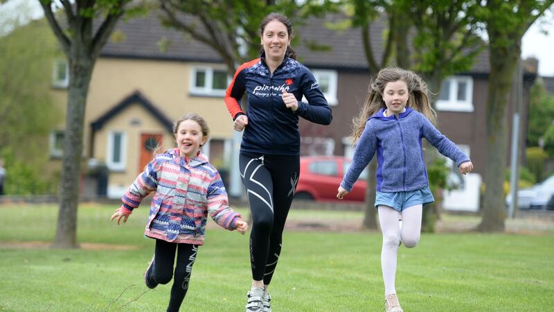 Jacqui Dunphy with  Beibhinn and Caoimhe. “When you have kids you have to make a choice: you miss your sessions or you get the first round done before they wake and you do the other one after they go to bed.” Photograph: Dara Mac Dónaill