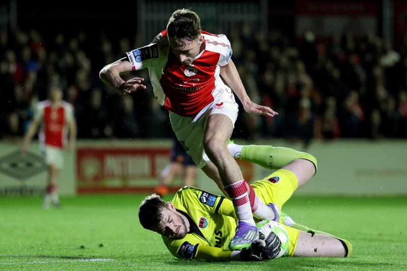 Cork City goalkeeper Conor Brann gets to the ball just ahead of Mason Melia. Photograph: Laszlo Geczo/Inpho