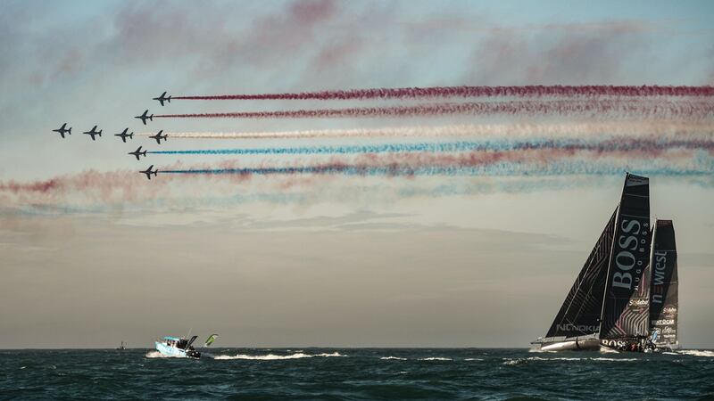 The French airforce’s aerobatics Patrouille de France flies over Britain skipper Alex Thomson’s boat Hugo Boss at the start of the race. File photograph: Getty