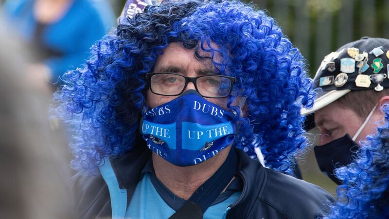 A Dublin fan pictured  at the funeral of Dublin supporter Tony Broughan. Photograph; Colin Keegan/Collins Dublin