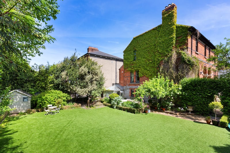 Sheltered by high box hedging and plenty of tall trees, the garden has its own access gate to Leeson Park, while another security gate leads to the front of the house.