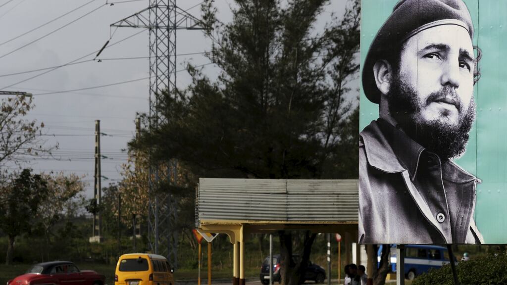 A poster bearing a youthful image of Cuba’s former president Fidel Castro (89) on a street in Havana earlier this month. Photograph: Enrique de la Osa/Reuters