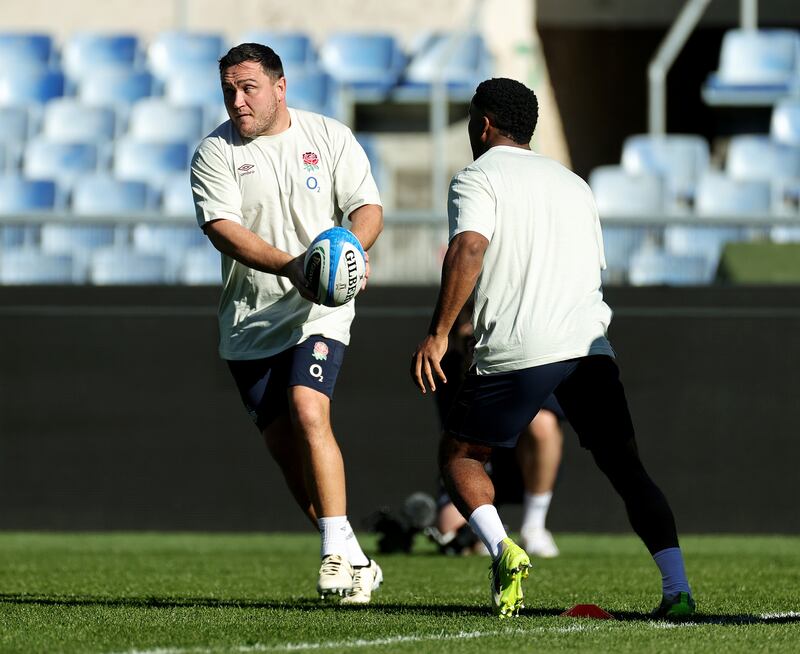 Jamie George runs with the ball whilst under pressure from Immanuel Feyi-Waboso during the England Captain's Run. Photograph: David Rogers/Getty Images