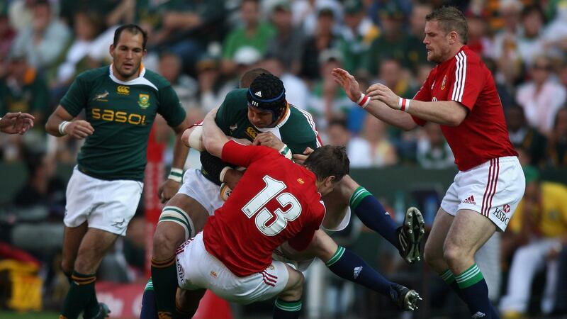 Brian O’Driscoll tackles South Africa’s Pierre Spies  during the First Test match in Durban in 2009. Photograph: David Rogers/Getty Images