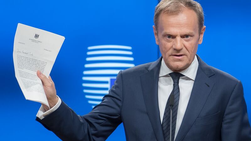 Donald Tusk, president of the European Union, holds the letter invoking Article 50  from the UK prime minister. Photograph: Jasper Juinen/Bloomberg