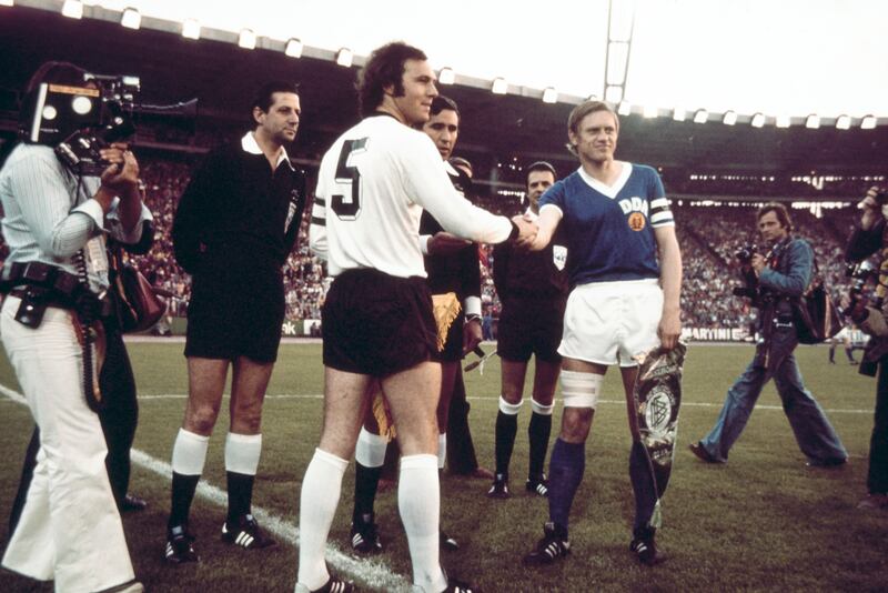 West Germany captain Franz Beckenbauer shakes hands with DDR captain Bernd Bransch in Hamburg on June 22nd, 1974.  Photograph: Allsport/Hulton Archive/Getty Images