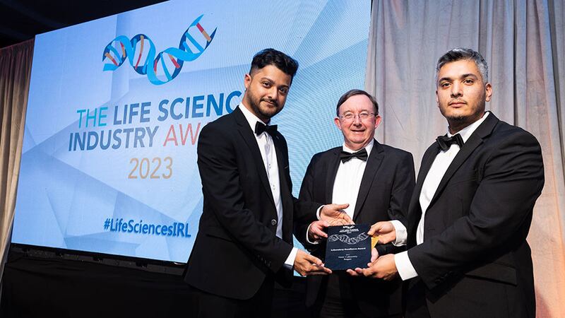 Eamon Judge, executive director, global engineering of Eli Lilly and Company, presents the laboratory excellence award to Arghya Mukherjee and Gaston Allendez, Teasgasc. Photograph: Jospeh Carr Photography