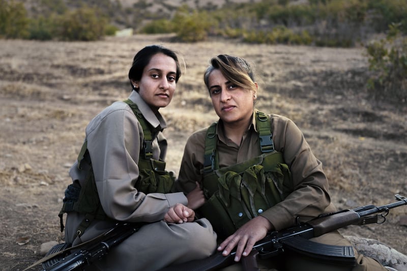 Parya Ghaisary and her mother, Nasim Fathi, during military training with Komala, an armed Iranian opposition group, in northern Iraqi Kurdistan. Photograph: Emily Garthwaite/New York Times
                      