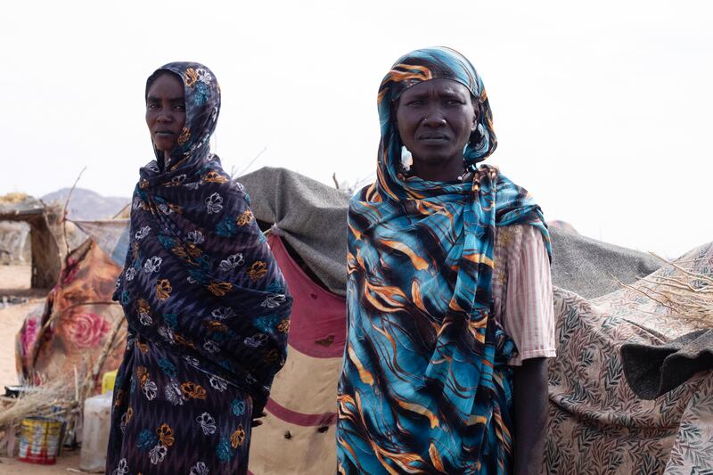 Displaced Sudanese women stand in front of their makeshift shelter in western Darfur after feeling El-Fasher, Sudan. Photograph: AFP/via Getty Images
