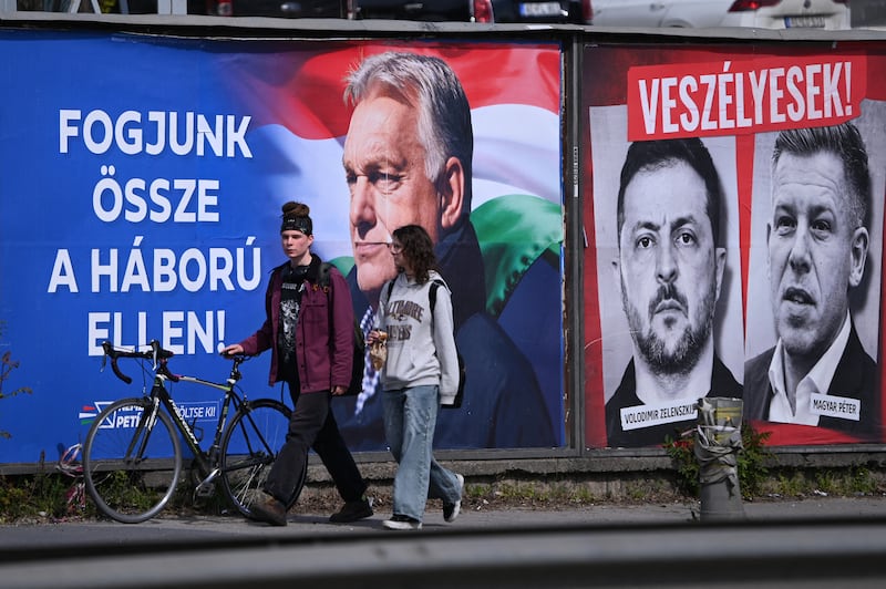 Billboards from April's election feature Viktor Orban with the slogan, 'Come together against the war', alongside pictures of Volodymyr Zelenskiy and Peter Magyar. Photograph: Attila Kisbenedek/AFP/Getty