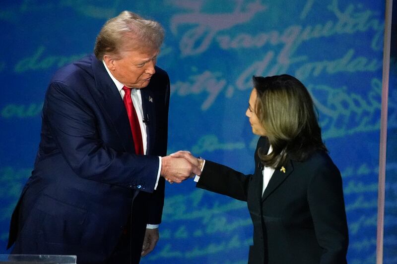  Donald Trump shakes hands with vice-president Kamala Harris. Photograph: Alex Brandon/AP