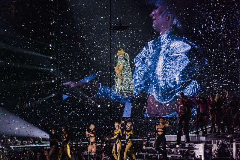 Beyoncé suspended by cables at the Rogers Centre in Toronto in July: It feels as though people want to be part of the cultural buzz around an event as much as they want to go to it. Photograph: The New York Times
                      