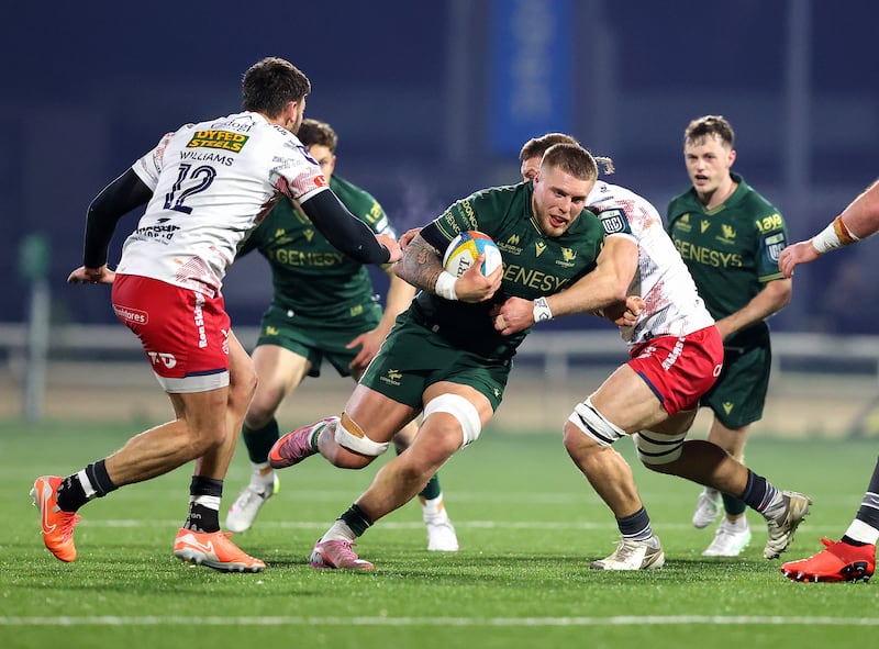 Sean Jansen gets past Jarrod Taylor of Scarlets during last season's URC match at Dexcom Stadium, Galway. Photograph:Tom O’Hanlon/Inpho