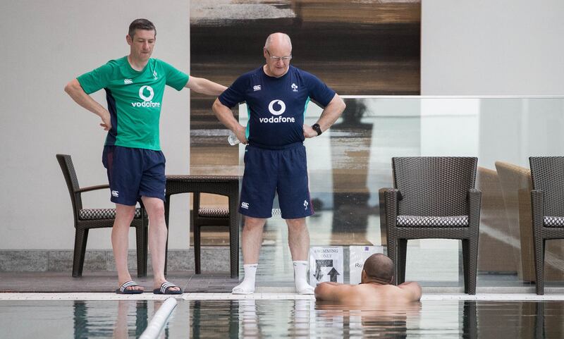 Physio Keith Fox and masseur Willie Bennett with Simon Zebo at an Ireland rugby squad pool recovery session at the  Conrad Tokyo in 2017. Photograph:   Ryan Byrne/Inpho