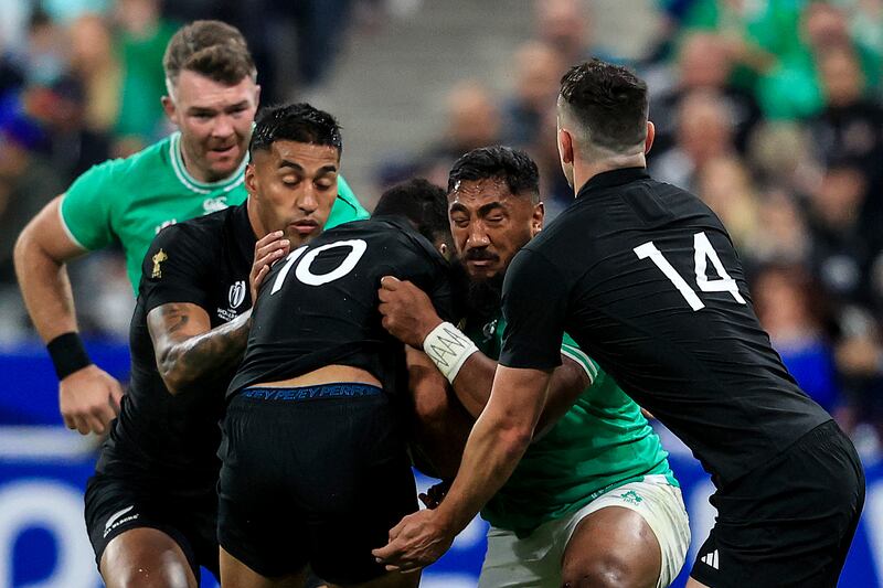 Bundee Aki and Richi Mo'unga in a collision in the first half. Photograph: Dan Sheridan/Inpho