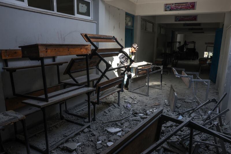 A Palestinian boy checks the damages at a UN school in Bureij in the central Gaza Strip, on November 21st. Photograph: Mohammed Abed/AFP/Getty