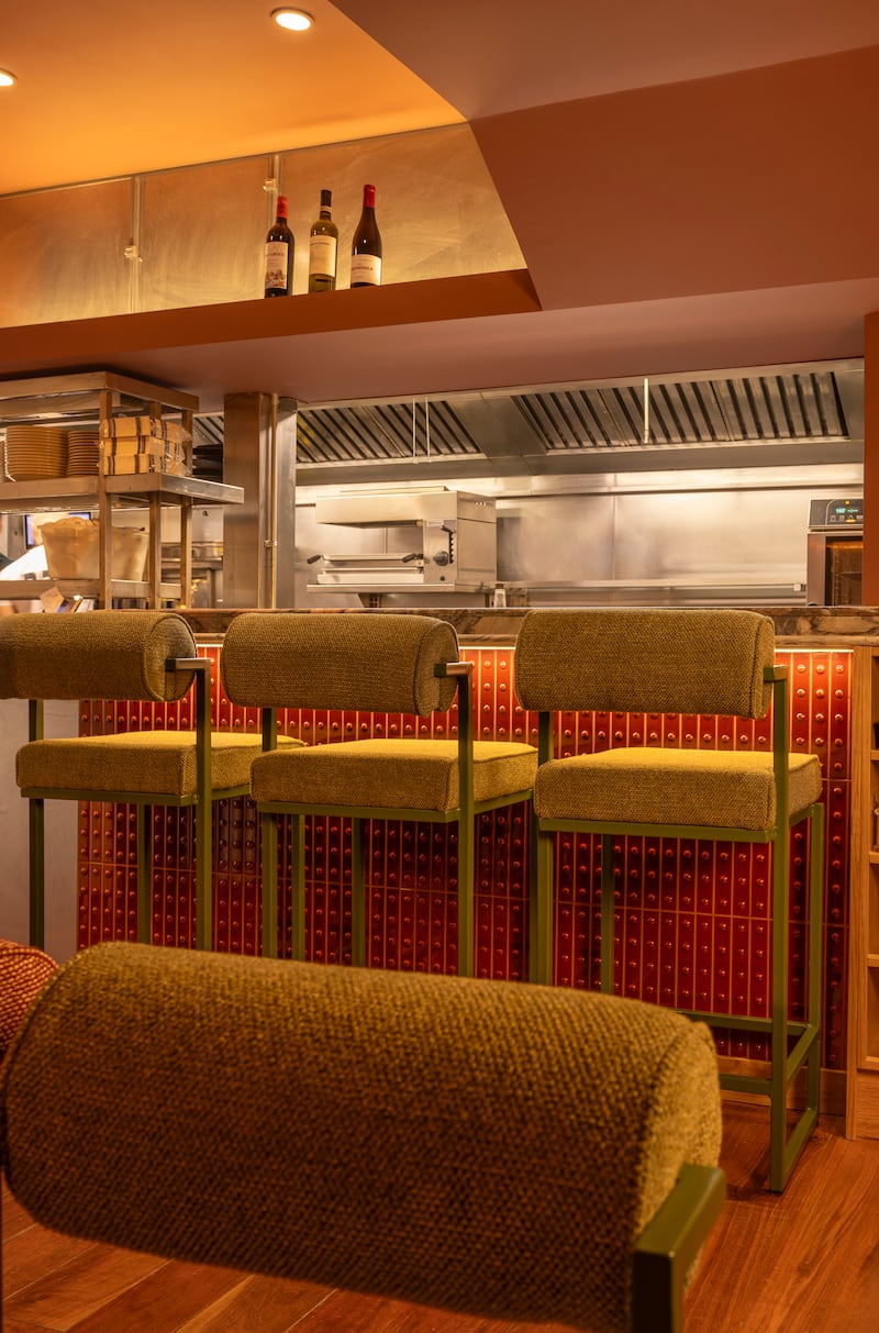 Seats with a kitchen view at Bang