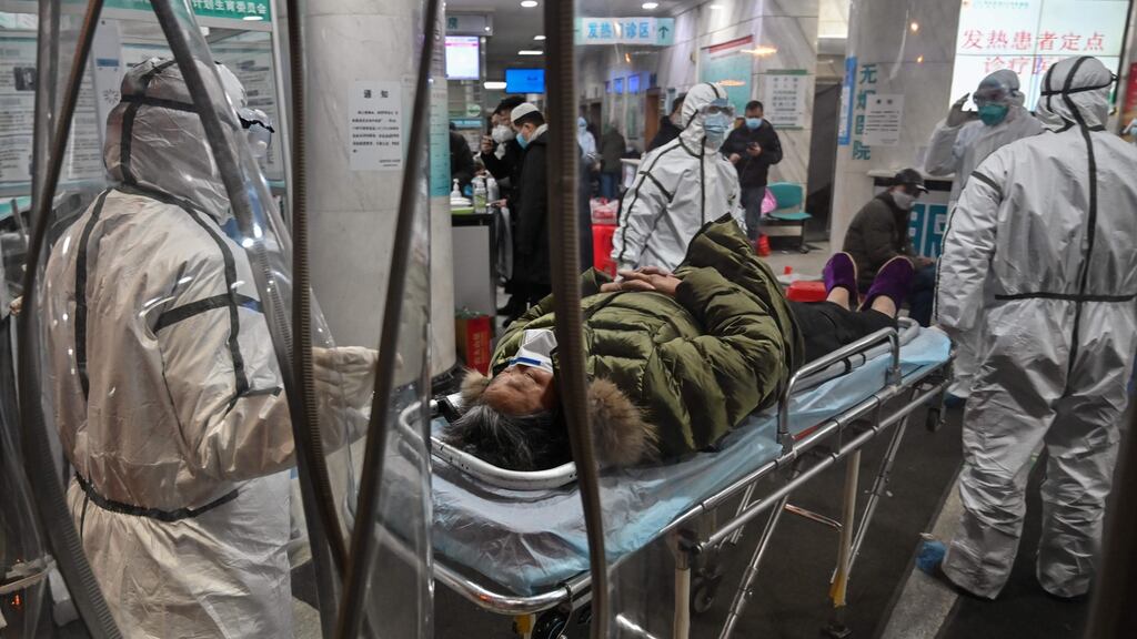 (Medical staff members wearing protective clothing to help stop the spread of a deadly virus which began in the city, arriving with a patient at the Wuhan Red Cross Hospital in Wuhan, in central China’s Hubei province. Photograph Hector Retamal/AFP via Getty Images