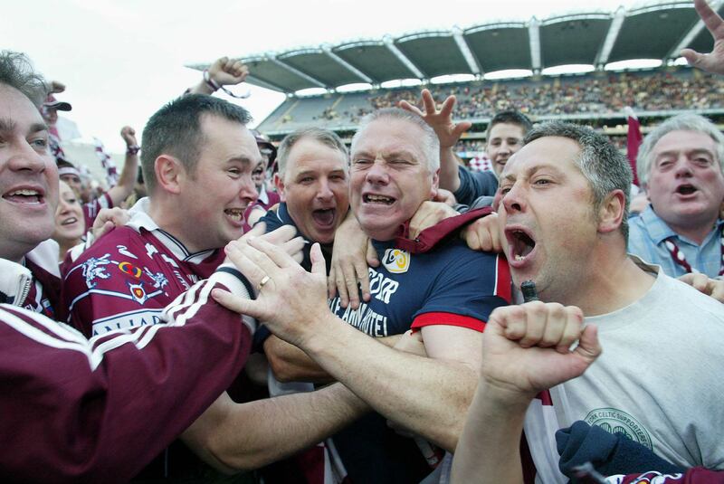 Westmeath manager Paidi Ó Sé is engulfed by supporters after the 2004 Leinster final replay against Laois. Photograph: Morgan Treacy/Inpho