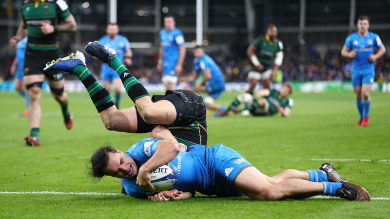 James Lowe   scores a try despite the challenge from Dan Biggar. Photo: Michael Steele/Getty Images