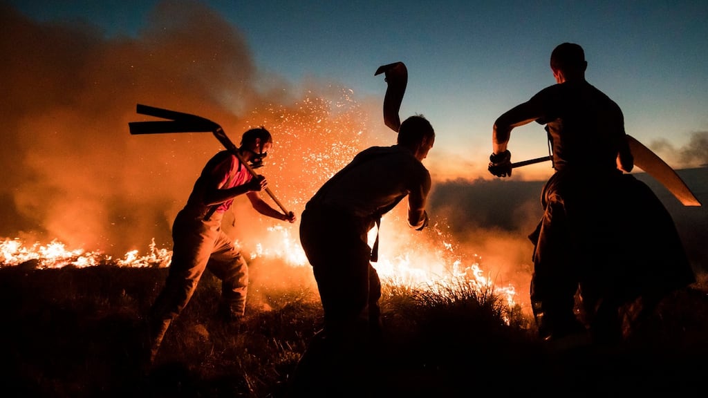 Firefighters tackle a wildfire on Winter Hill near Bolton. Photograph: Danny Lawson/PA Wire.