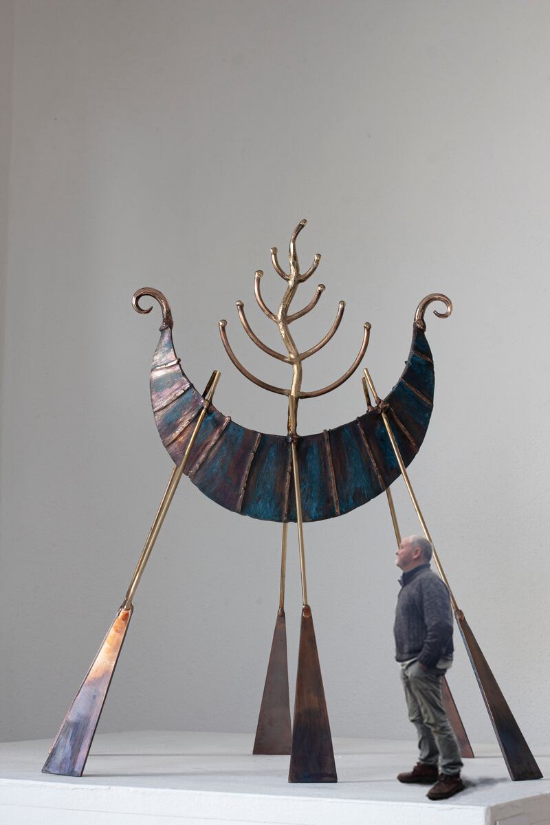 Ronan Halpin alongside one of his works