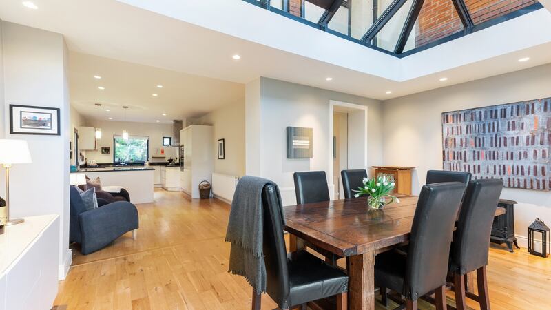 Extended dining-living room with pitched glass roof