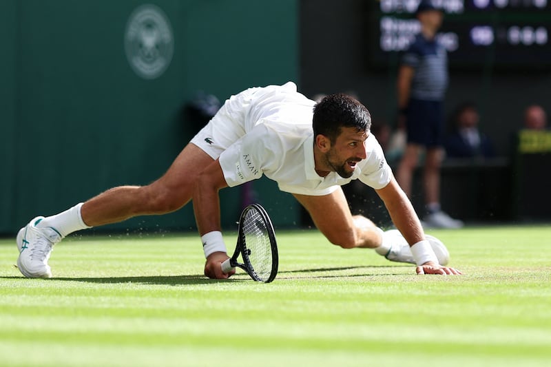 Novak Djokovic returns the ball to Australia's Alex de Minaur at Wimbledon. Photograph: Adrian Dennis/AFP via Getty Images         