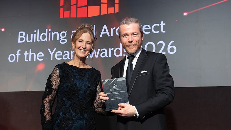 Martina Murphy, awards judge, presents the building refurbishment for a single building or development to Mark Whelan, NBK Architects