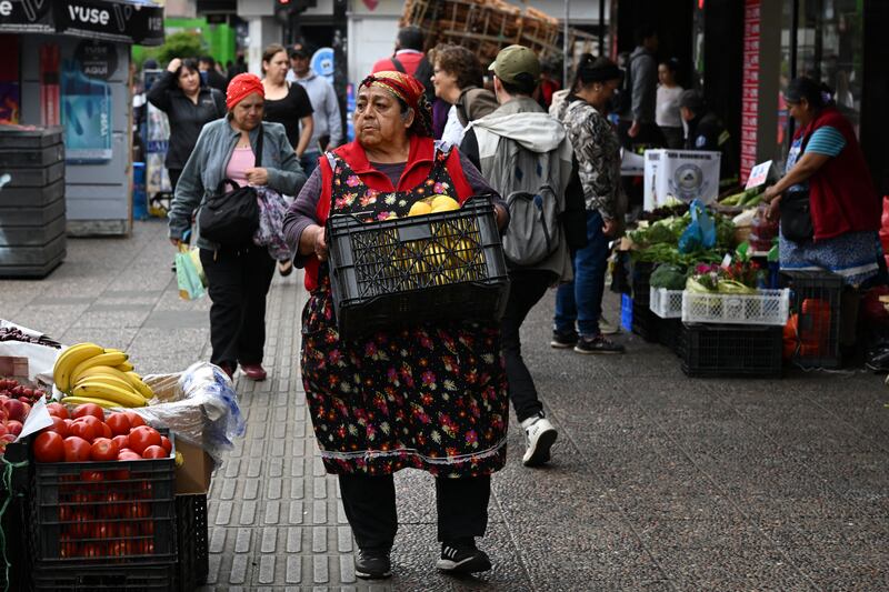 A fruit seller at Paseo Bulnes in Temucho, Chile. Photograph: Eitan Abramovich/AFP/Getty