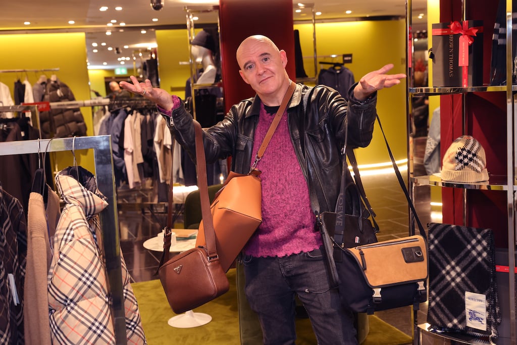 Conor Pope looking at some man bags in Brown Thomas, Grafton Street, Dublin. Photograph: Dara Mac Dónaill