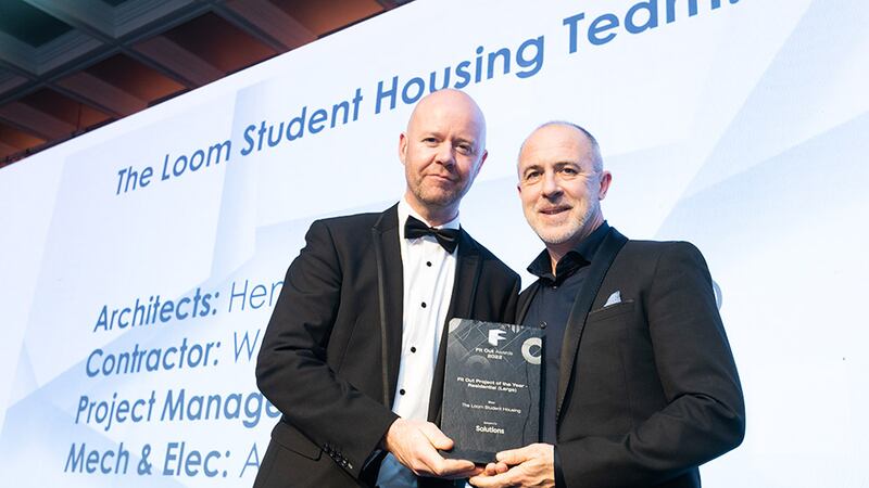 John McDonagh, managing director, Solutions presents the Fit Out Project of the Year - Residential (Large) award to Peter McGovern, Henry J Lyons.