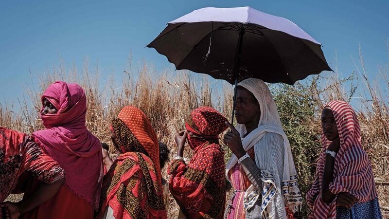 Ethiopian refugees   queue to register for food aid at Um Raquba reception camp in Sudan’s eastern Gedaref state. Photograph: Chiba/AFP