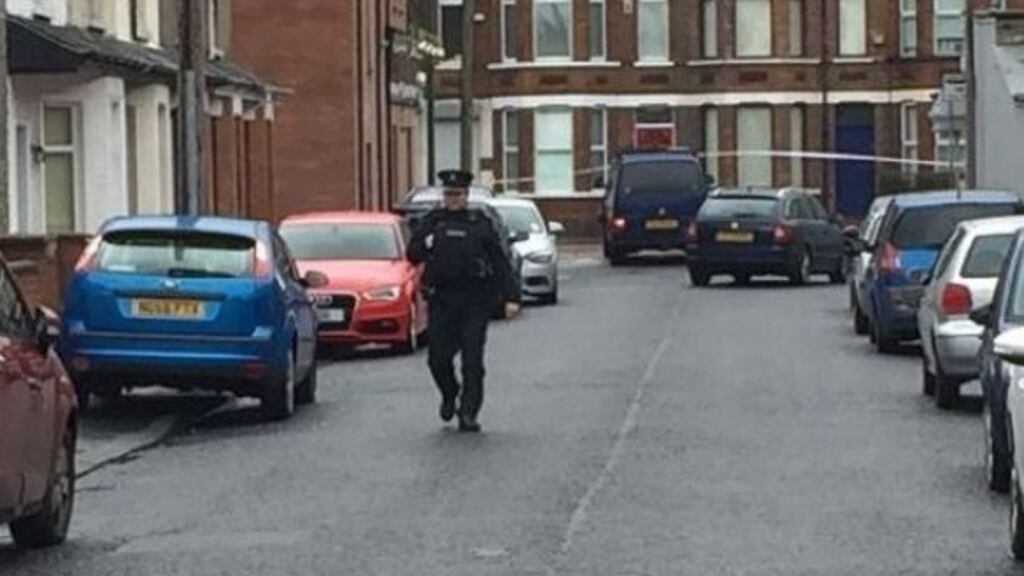 A police officer at the scene where an explosive device detonated under a van in east Belfast, injuring a prison officer. Photograph: Lesley-Anne McKeown/PA Wire