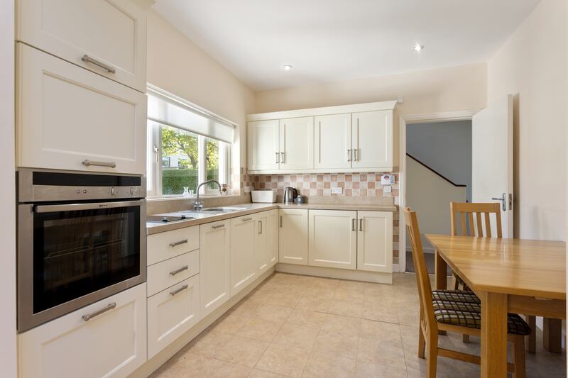 The kitchen, recently renovated, lies to the back of the house; it’s bright and modern, with cream timber units. Photograph: Angela Mujica