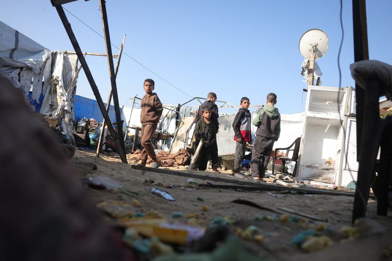 Children stand at the site where Palestinians were killed on December 3rd by an Israeli strike in Khan Younis, Gaza Strip, on December 4th, 2025. Photograph: BASHAR TALEB/AFP via Getty Images