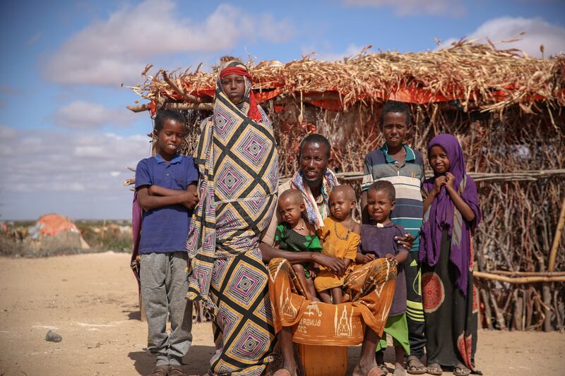 Ambiyo and Mahat Ibrahim with their children Willo, Issack, Fathan, Nastehsa, Mohammad, Zelinab and Feisal, near their home in an IDP camp, Luuq, Somalia.