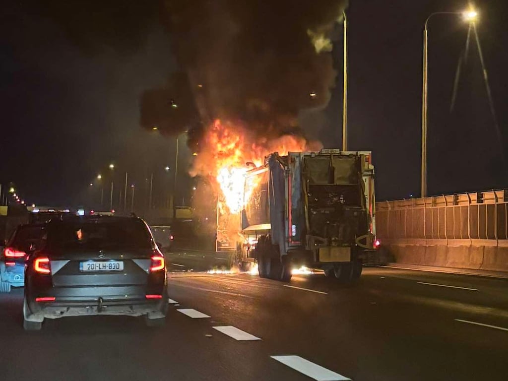 The bin lorry on fire on the Westlink Bridge on southbound carriageway of the M50 on Tuesday night. Photograph: KildareWeather/X