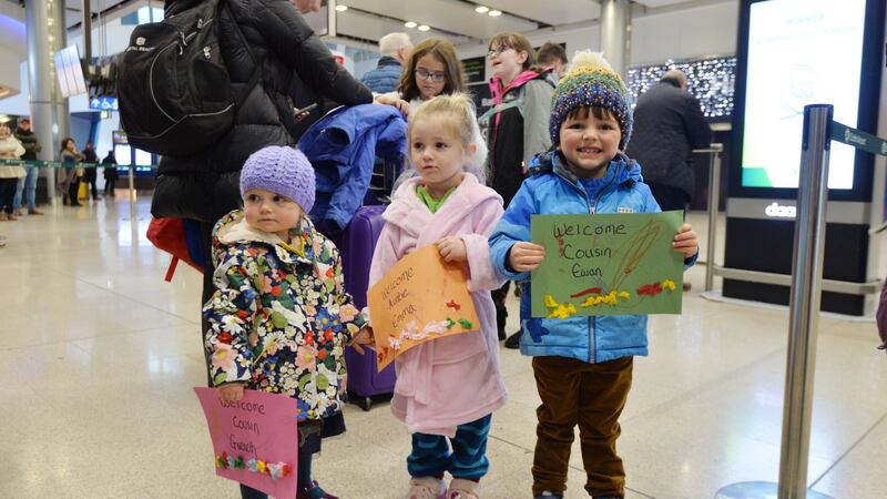 Emilia, Zola and Lachlan waiting for  their aunt and uncle Emma and Jason Larson to arrive. Photograph: Alan Betson / The Irish Times