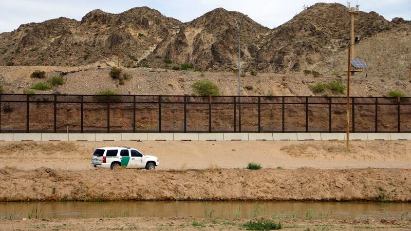 A US Border Patrol, seen from Mexico, patrolling along the border line between El Paso, Texas, and Ciudad Juarez in  Mexico. Photograph:  Herika Martinez/AFP/Getty Images)