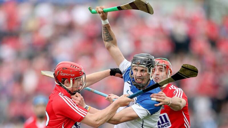Cork’s Bill Cooper and Stephen O’Donnell challenge Waterford’s  Maurice Shanahan during the Munster SHC semi-final at Semple Stadium in Thurles. Photo:   James Crombie/Inpho
