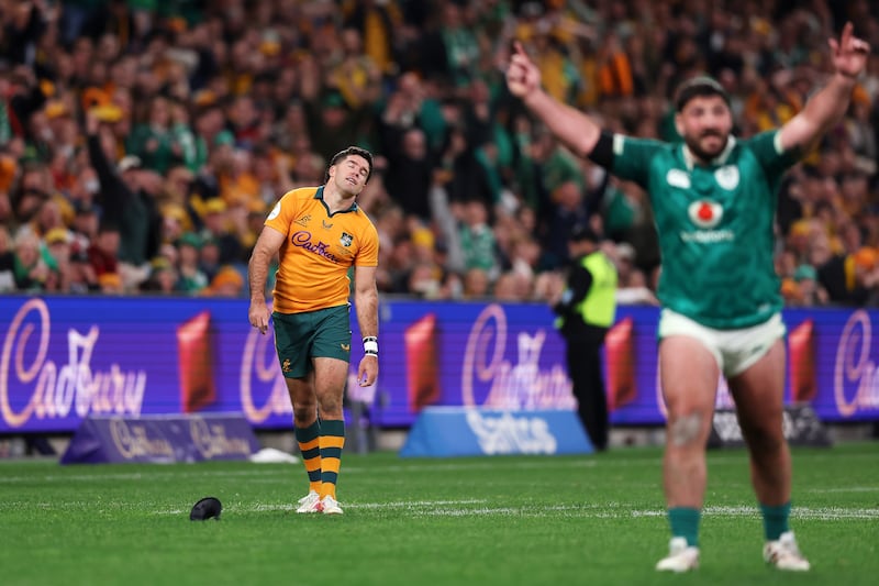 Ben Donaldson of the Wallabies looks dejected as Tom O'Toole of Ireland celebrates victory in Sydney. Photograph: Mark Kolbe Photography/Getty