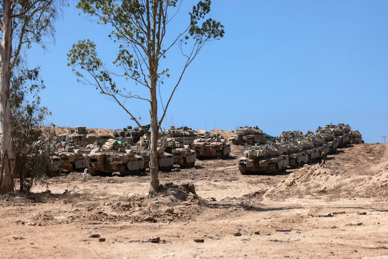 A convoy of Israeli tanks deployed at the border with the Gaza Strip. Photograph: Menahem Kahana/AFP via Getty Images       