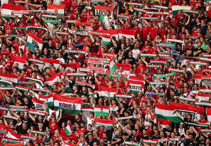 Fans of Hungary hold up flags and scarves during a Euro 2024 group stage match between Albania and Spain at Dusseldorf Arena in June. Photograph: Catherine Ivill/AMA/Getty Images