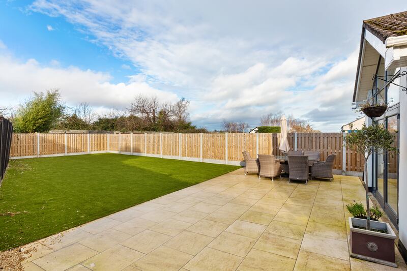 Rear garden has AstroTurf and a patio