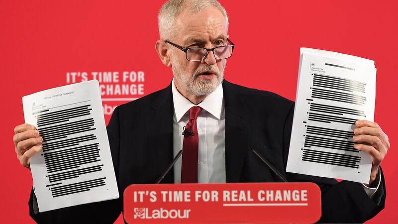 Labour Party leader Jeremy Corbyn holds up redacted documents of secret talks between the UK and US governments during a speech on the NHS in London, November 27th 2019. Photograph: Andy Rain/EPA
